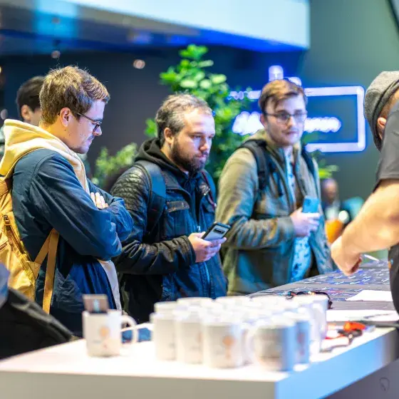 Attendees getting their swag at React Brussels