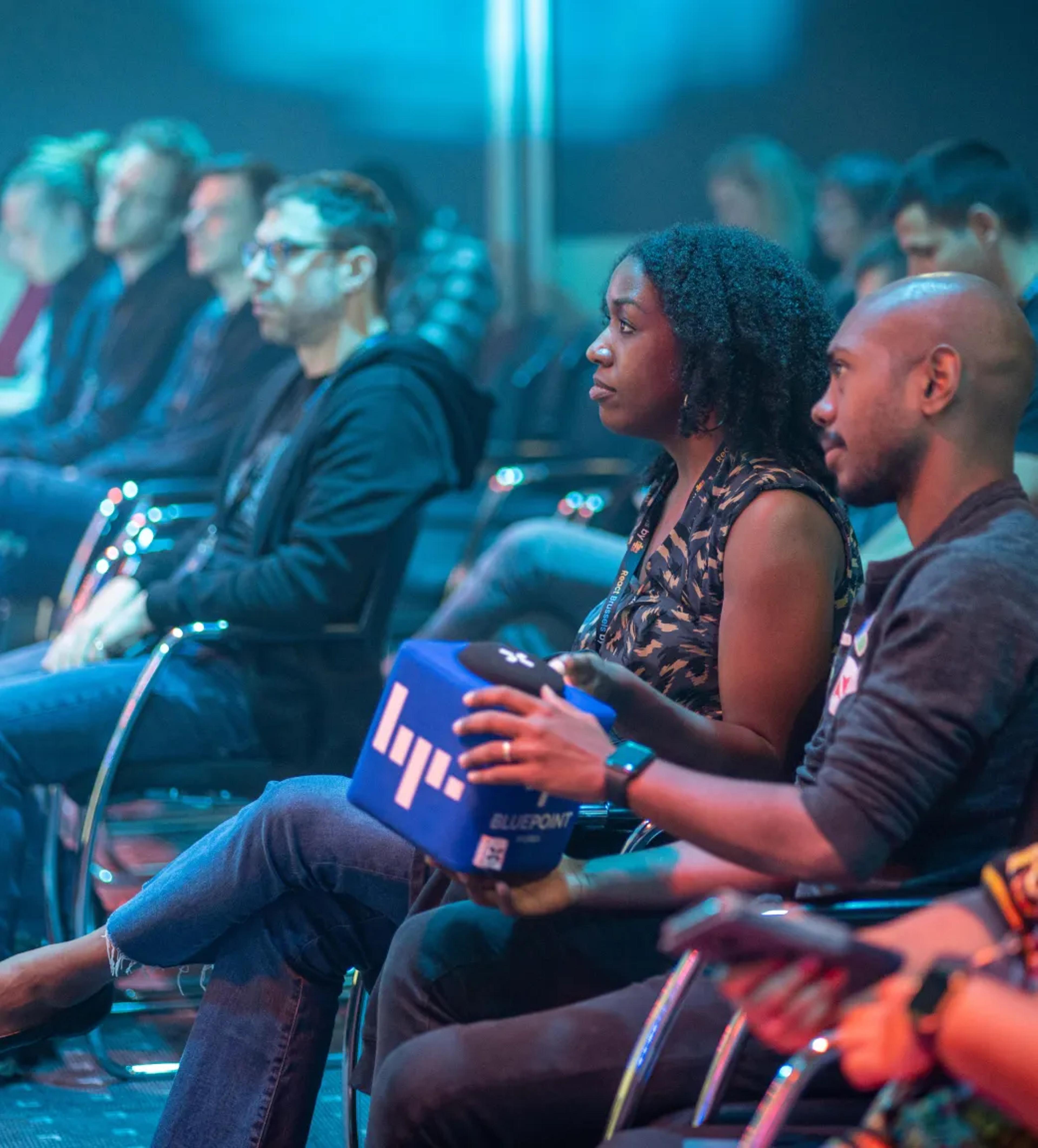 Speakers asking questions at React Brussels